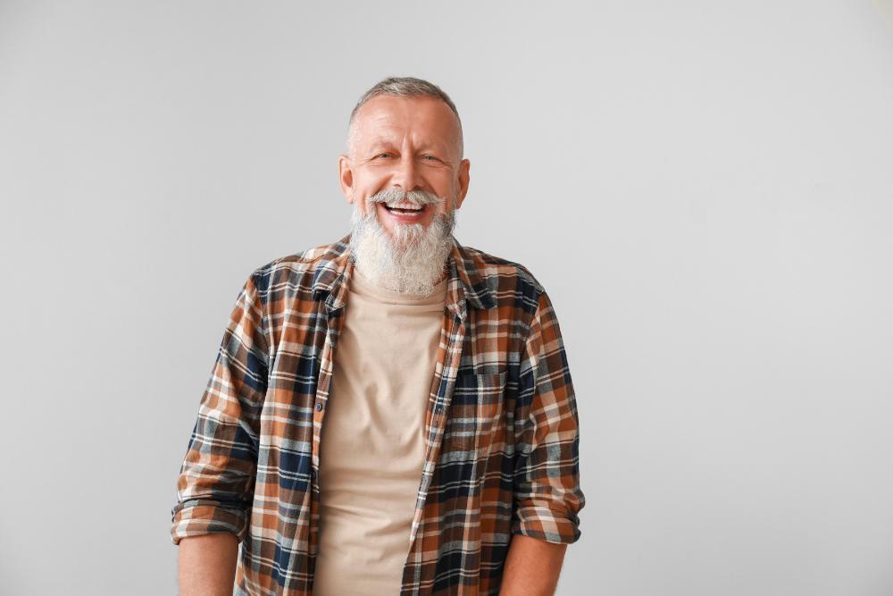 An older man laughing
