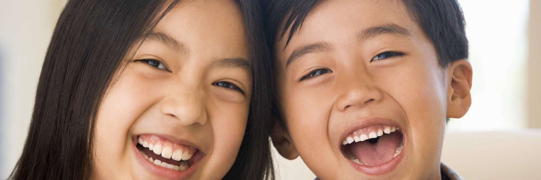 A laughing brother and sister