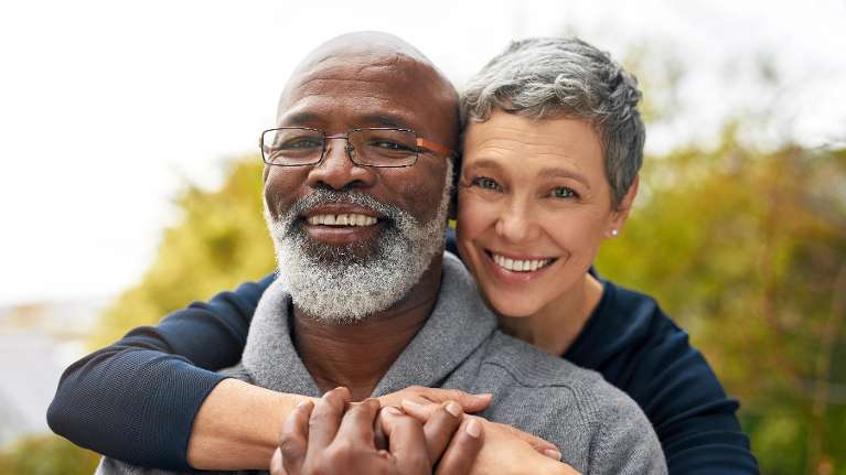 A smiling older couple